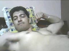 Indian guy cums while flexing muscles